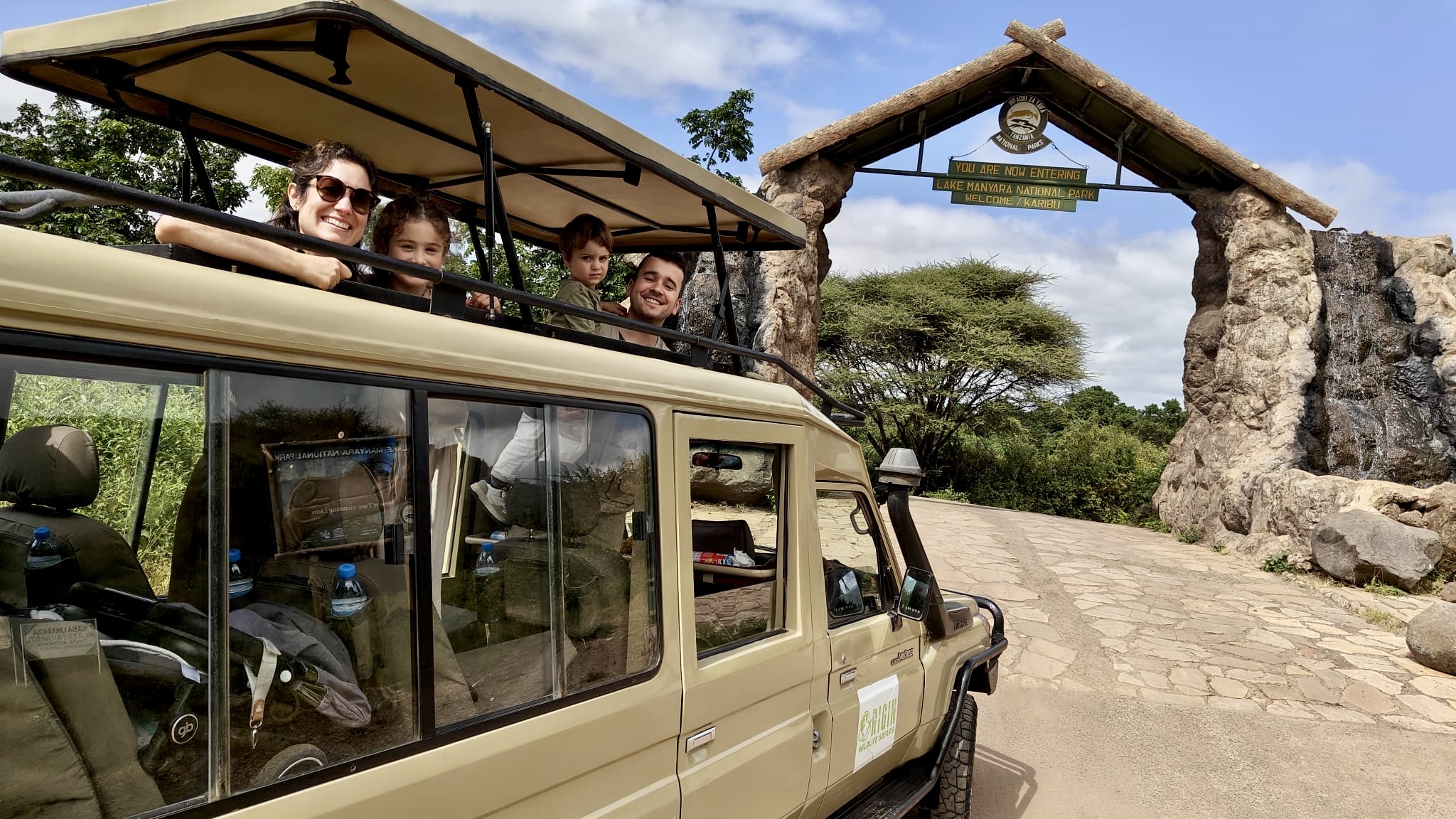 Tourists in a 4x4 toyota land cruiser heading into ngorongoro national park
